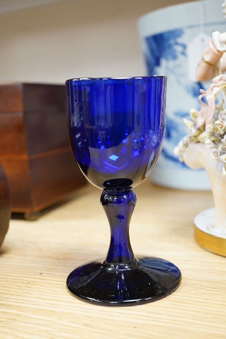 Sundry porcelain comprising three German figures, a Royal Worcester blush ivory ewer and a mug, together with a blue wine glass, largest 26cm high